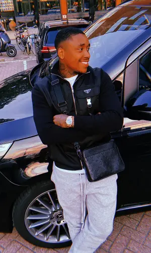 Steven Bergwijn wearing Louis Vuitton bag