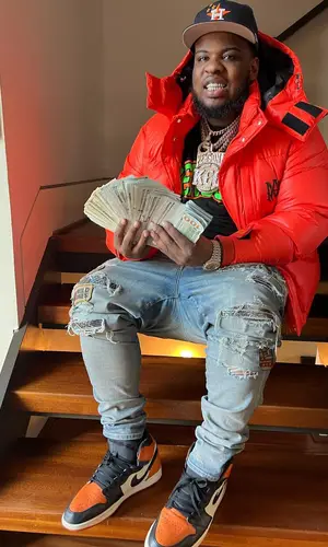 Maxo Kream wearing Travis Scott Merch cap