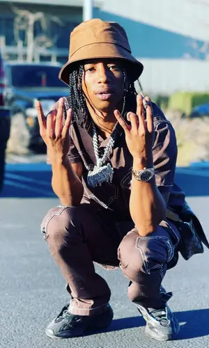 Pressa wearing Gucci bag