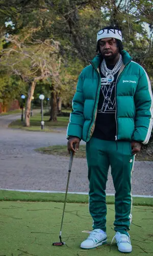 EST Gee’s Outfit in Palm Angels Jacket, Louis Vuitton T-Shirt & Moncler Hat (2022)