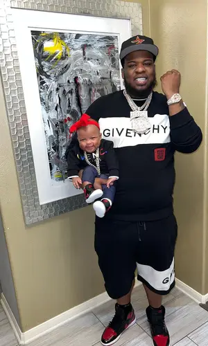 Maxo Kream wearing Givenchy sweatshirt