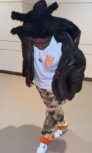 Kodak Black wearing Amiri t-shirt