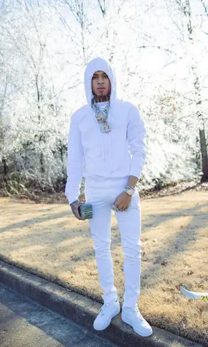 NLE Choppa wearing Moose Knuckles hat