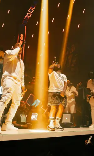 Yo Gotti wearing Palm Angels t-shirt