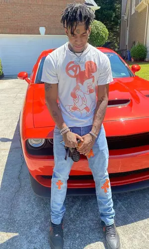 Thouxanbanfauni wearing Life Is War t-shirt