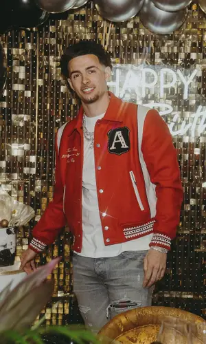 Curtis Jones wearing Amiri jeans