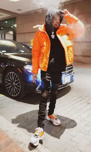 Lil Poppa wearing Amiri jacket