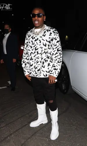 DaBaby wearing Louis Vuitton boots