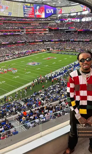 Quavo wearing Louis Vuitton sweatshirt
