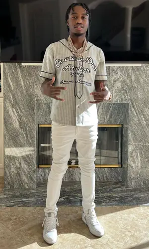Lil Tjay wearing Dior shirt