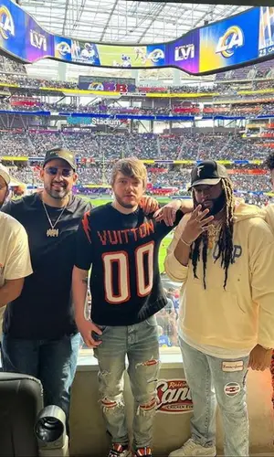 Murda Beatz wearing Amiri jeans