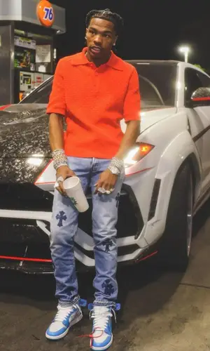 Lil Baby wearing Bottega Veneta shirt
