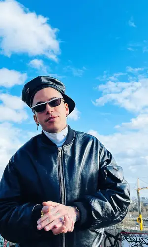 Sfera Ebbasta wearing Prada sweater