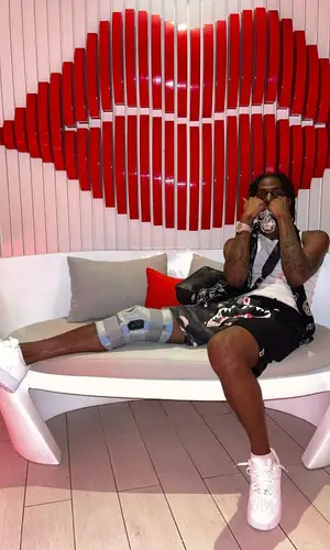 Russ Millions wearing Nike sneakers