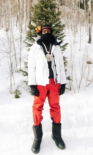 Polo G wearing Prada boots