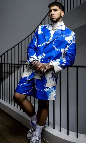 Anuel AA wearing Louis Vuitton jacket