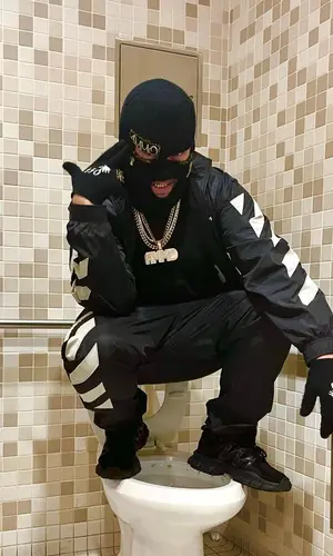 Lil Toe wearing Off-White pants