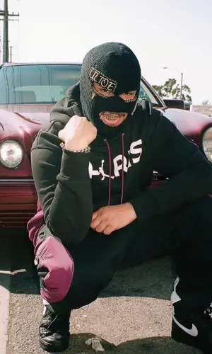 Lil Toe wearing Jordan pants