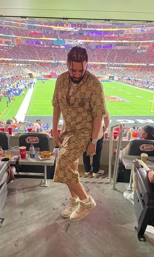 French Montana wearing Gucci shirt