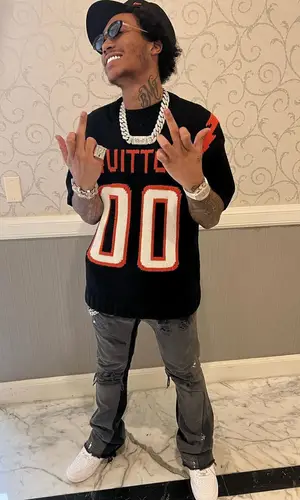 Lil Meech wearing New Era cap