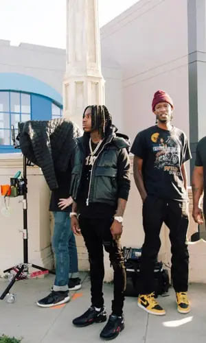Polo G wearing Louis Vuitton bag