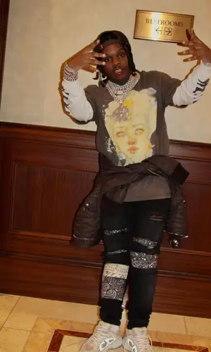 42 Dugg wearing Saint Michael t-shirt