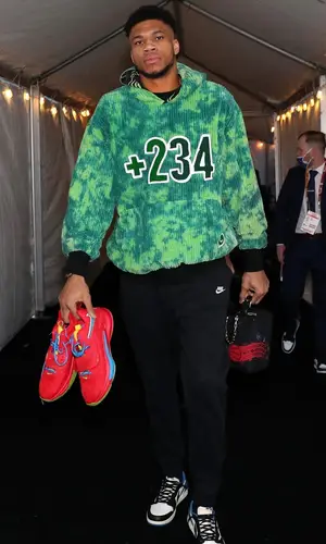 Giannis Antetokounmpo wearing Louis Vuitton bag