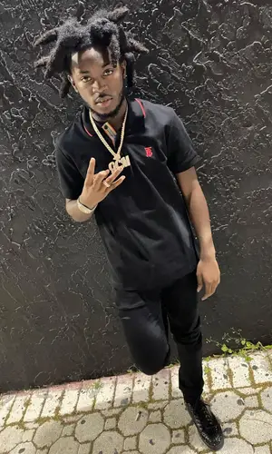 LPB Poody wearing Christian Louboutin sneakers