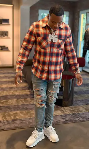 BandMan Kevo wearing Amiri jeans