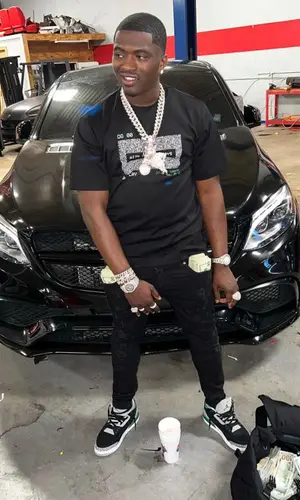 Bankroll Freddie wearing Dolce & Gabbana backpack