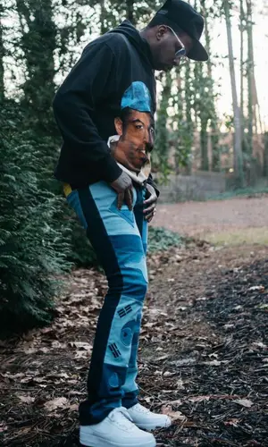 Lil Duke’s Outfit in Barriers Hoodie, Whensmokeclears Jeans & Nike Sneakers (2022)