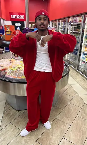 Lil Tjay wearing Balenciaga jacket