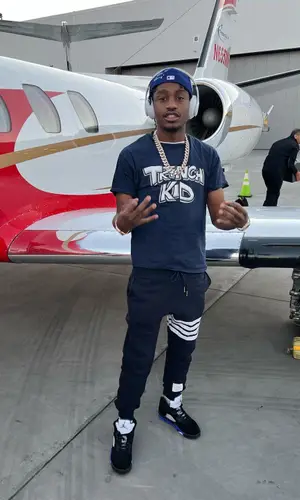 Lil Tjay wearing Hidden Hills cap