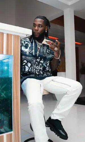 Burna Boy wearing Givenchy boots