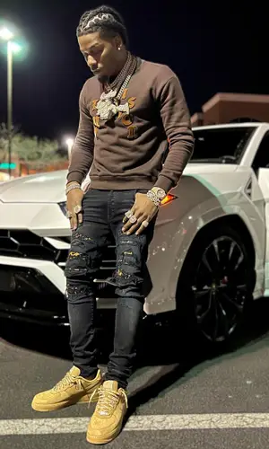 CJ So Cool wearing Louis Vuitton sweatshirt
