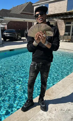 Lil Migo wearing Dior sneakers