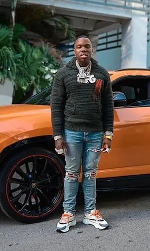 BandMan Kevo wearing Amiri jeans