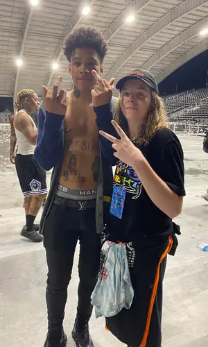 K Suave wearing Louis Vuitton belt