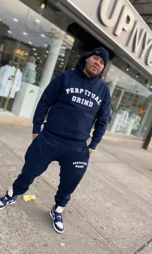 Fat Joe’s Outfit in Perpetual Grind Hoodie, Nike Sneakers & Prada Cap (2022)