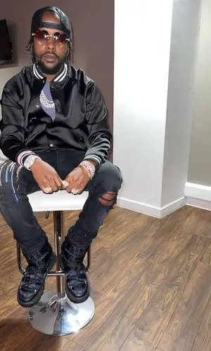 Popcaan’s Outfit in Amiri Jacket & Dior Boots (2022)