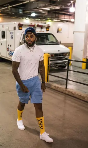 Kevin Gates wearing Nike shorts
