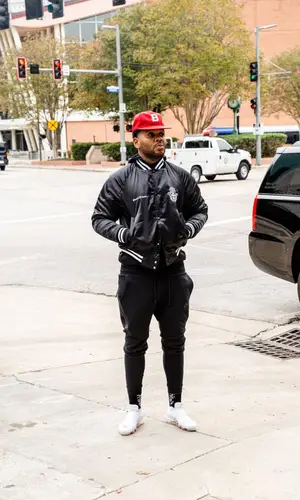 Kevin Gates wearing Kevin Gates Merch cap
