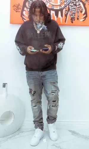 Ballout wearing Amiri jeans