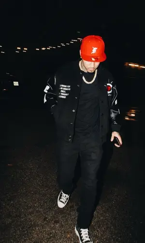 Kirko Bangz wearing Fear of God cap