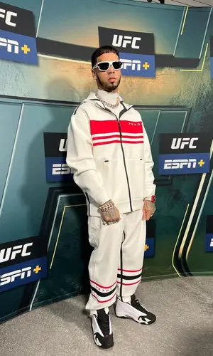 Anuel AA wearing Prada jacket