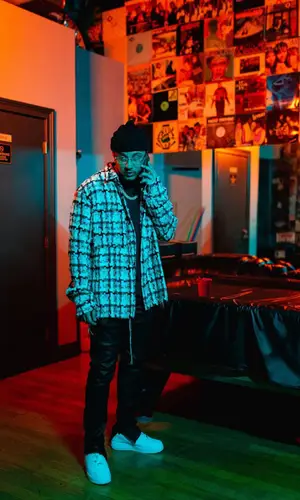 Kirko Bangz wearing Nike sneakers
