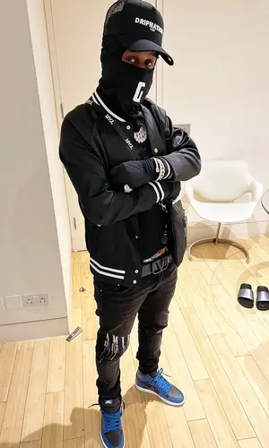 Popcaan’s Outfit in The Couture Club Jacket, Amiri Jeans & Valentino Belt (2022)