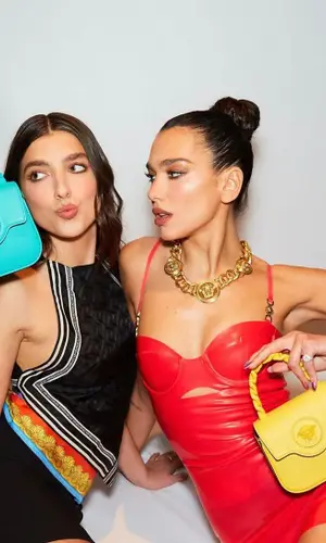 Dua Lipa wearing Versace bag