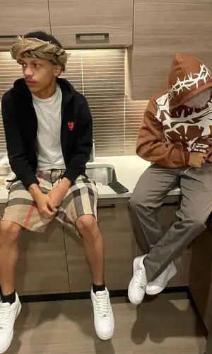 Iayze wearing Burberry swimwear