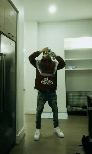 Iayze wearing Fuck The Population jacket